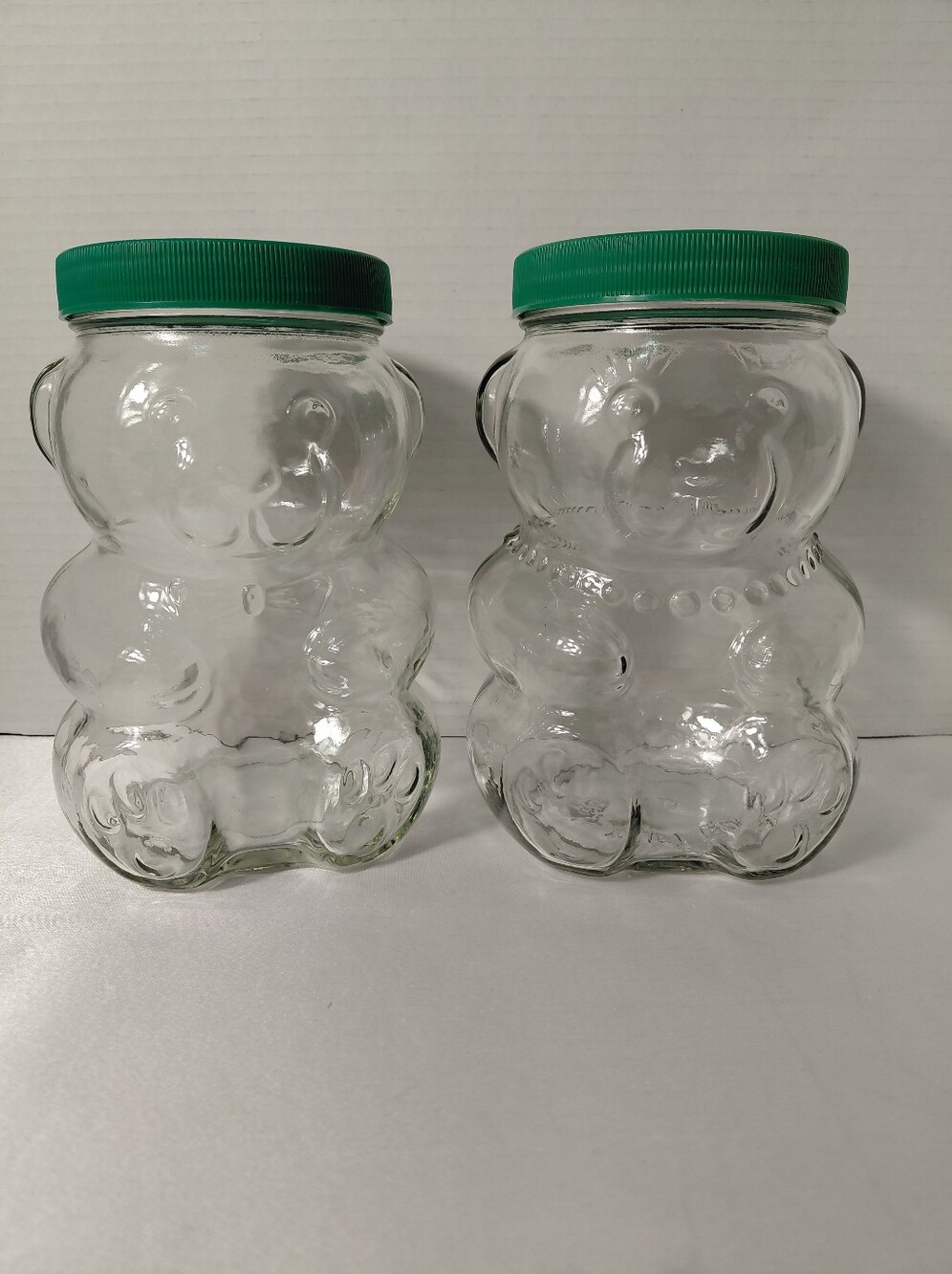 Pair of Vintage Clear Glass Kraft Peanut Butter Bear Jars with Green Lids